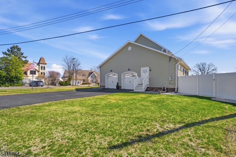 663 Harbor Road Brick, NJ 08724 - Photo 37 of 46 a front view of house with yard and outdoor seating