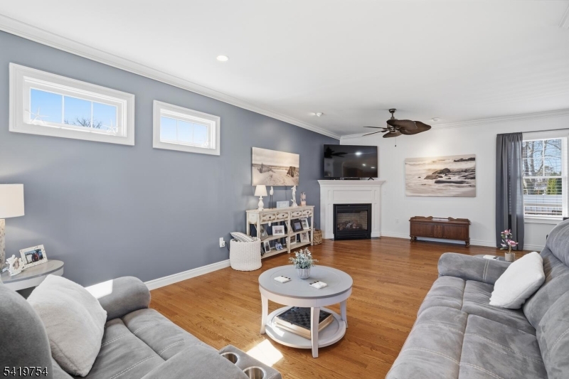 663 Harbor Road Brick, NJ 08724 - Photo 8 of 46 a living room with furniture and a fireplace