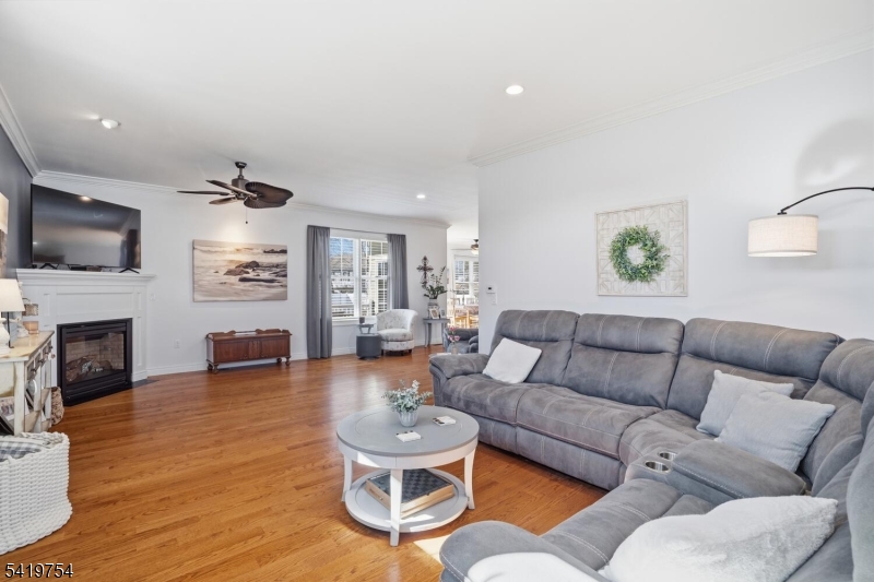 663 Harbor Road Brick, NJ 08724 - Photo 9 of 46 a living room with fireplace furniture and a wooden floor