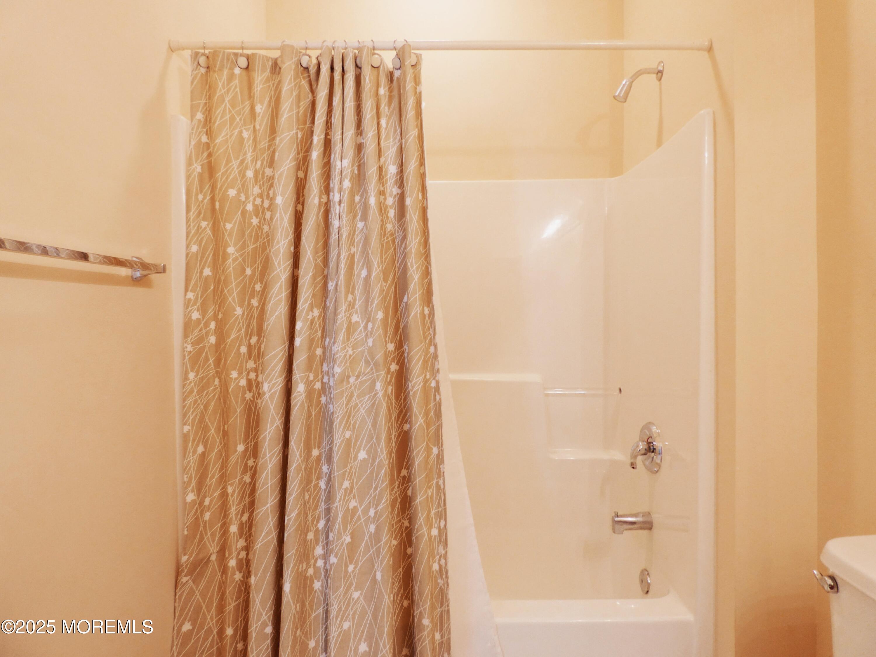 10 Lilly Drive Little Egg Harbor, NJ 08087 - Photo 13 of 28 a bathroom with a shower and a tub
