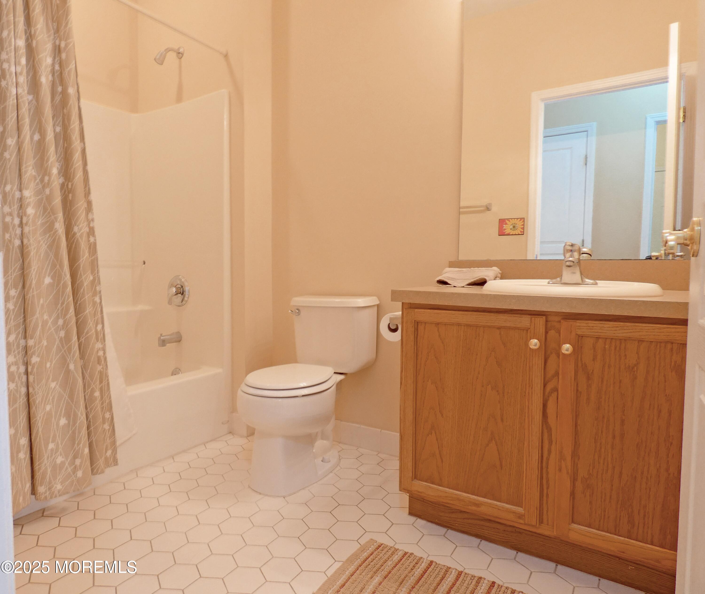 10 Lilly Drive Little Egg Harbor, NJ 08087 - Photo 15 of 28 a bathroom with a toilet a sink and bathtub