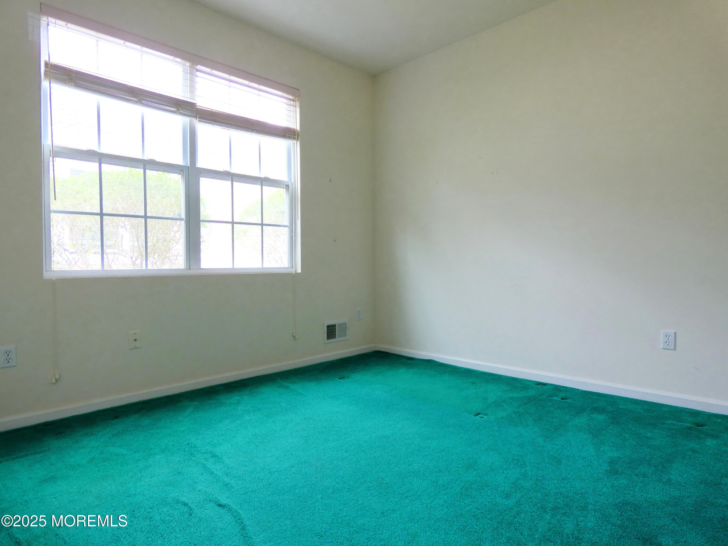 10 Lilly Drive Little Egg Harbor, NJ 08087 - Photo 18 of 28 an empty room with a window