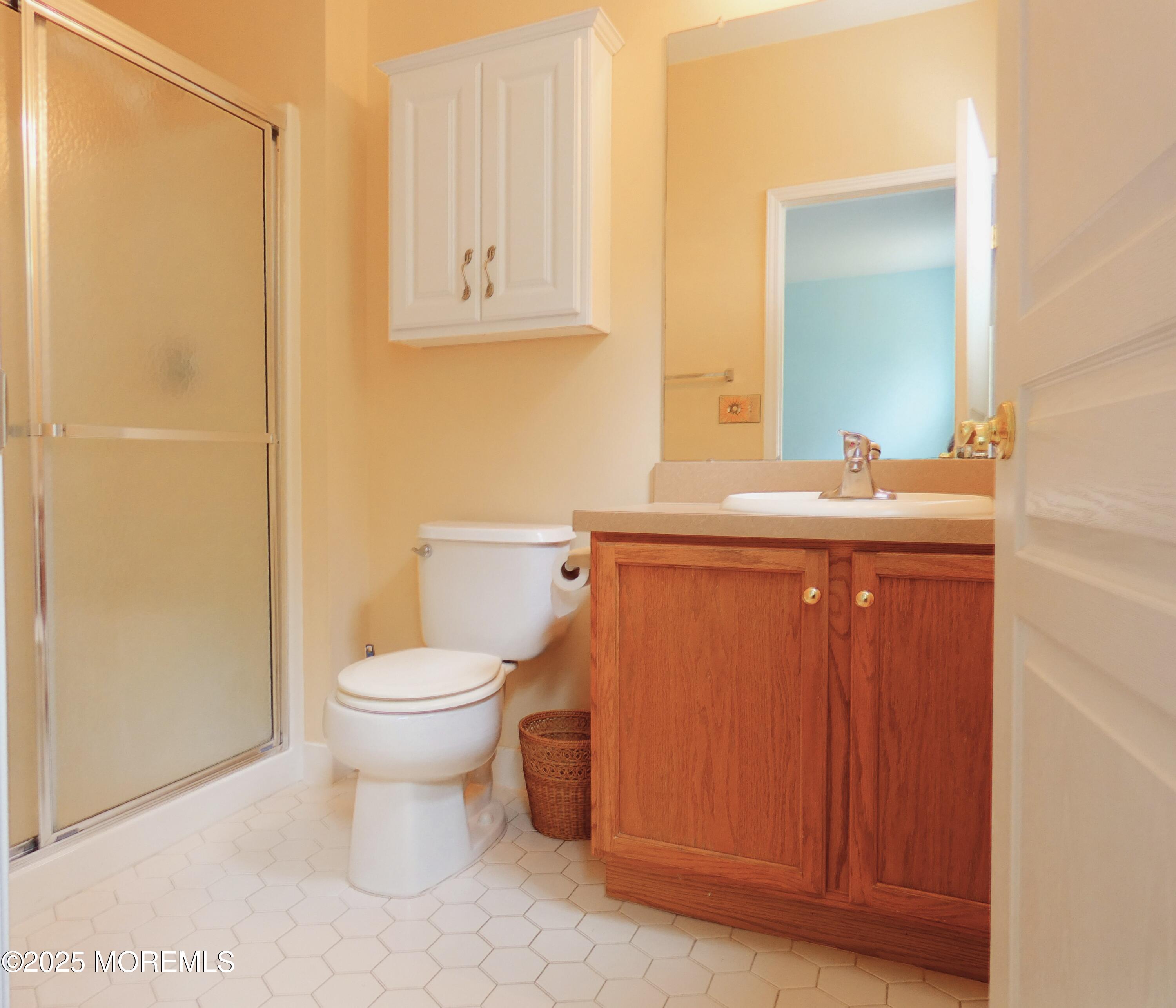 10 Lilly Drive Little Egg Harbor, NJ 08087 - Photo 20 of 28 a bathroom with a sink a toilet and mirror