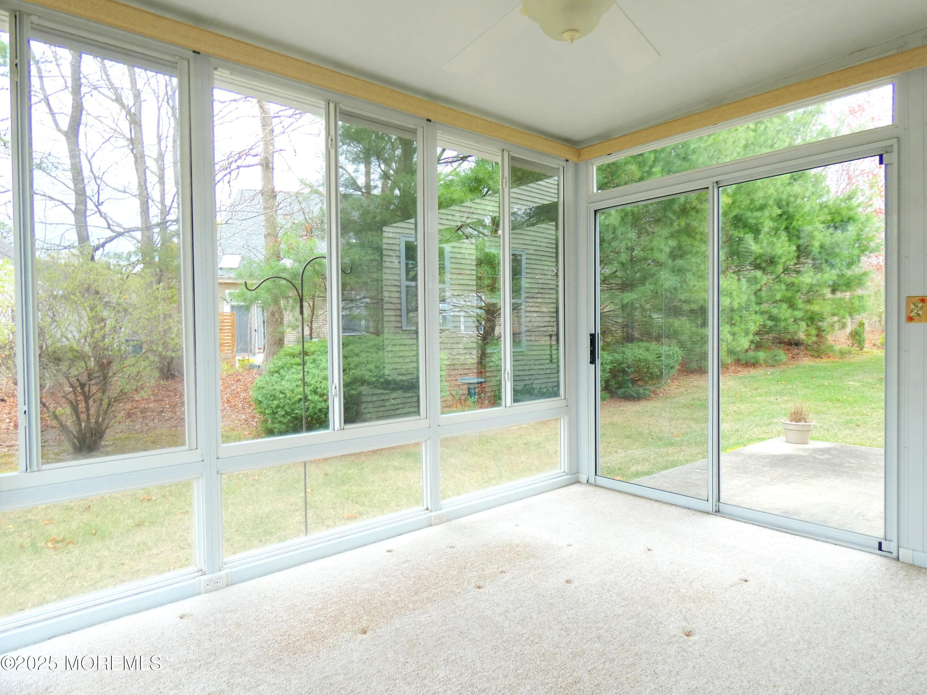 10 Lilly Drive Little Egg Harbor, NJ 08087 - Photo 25 of 28 a view of an empty room with wooden floor and a window
