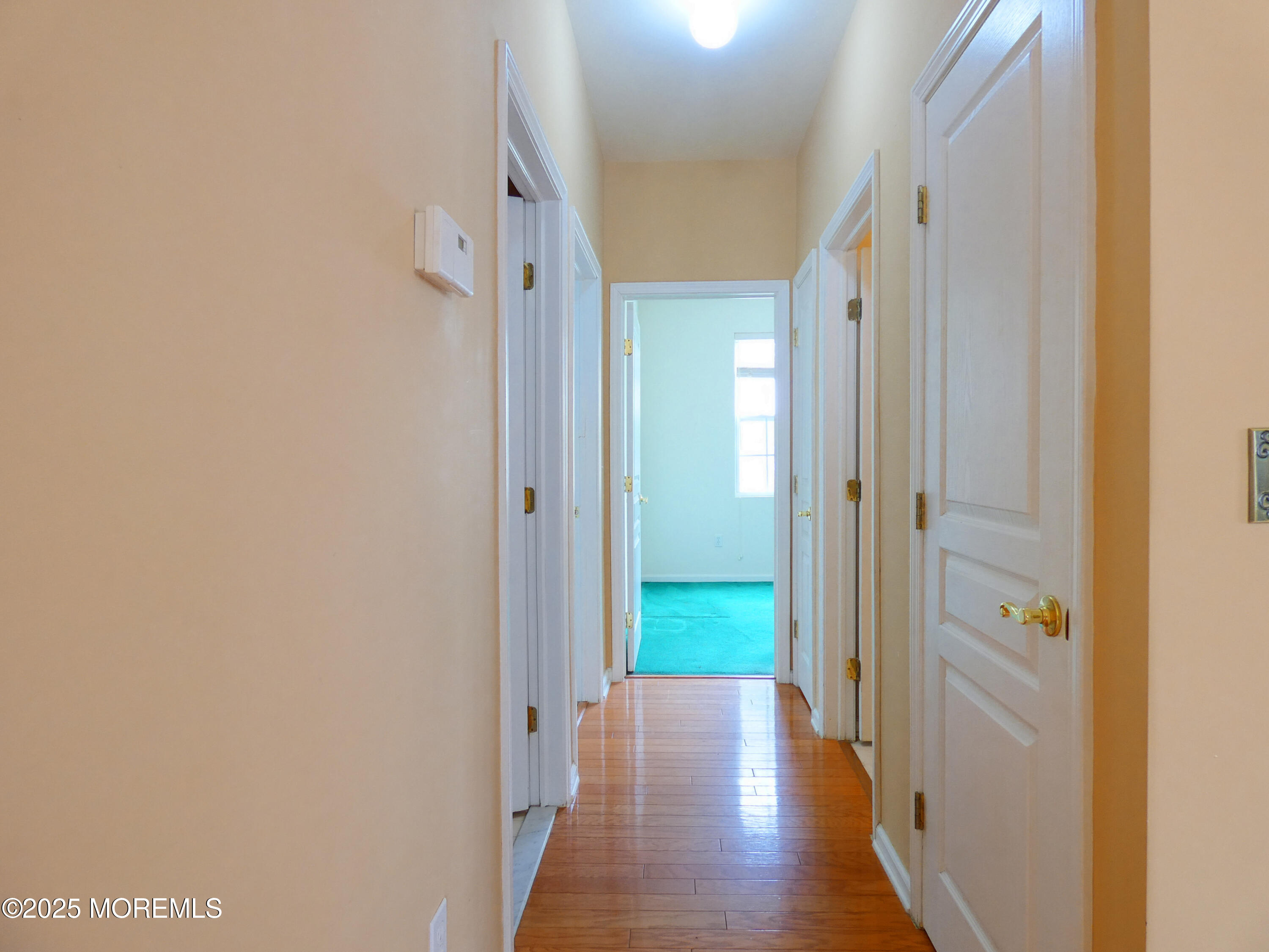 10 Lilly Drive Little Egg Harbor, NJ 08087 - Photo 6 of 28 a view of a hallway with wooden floor