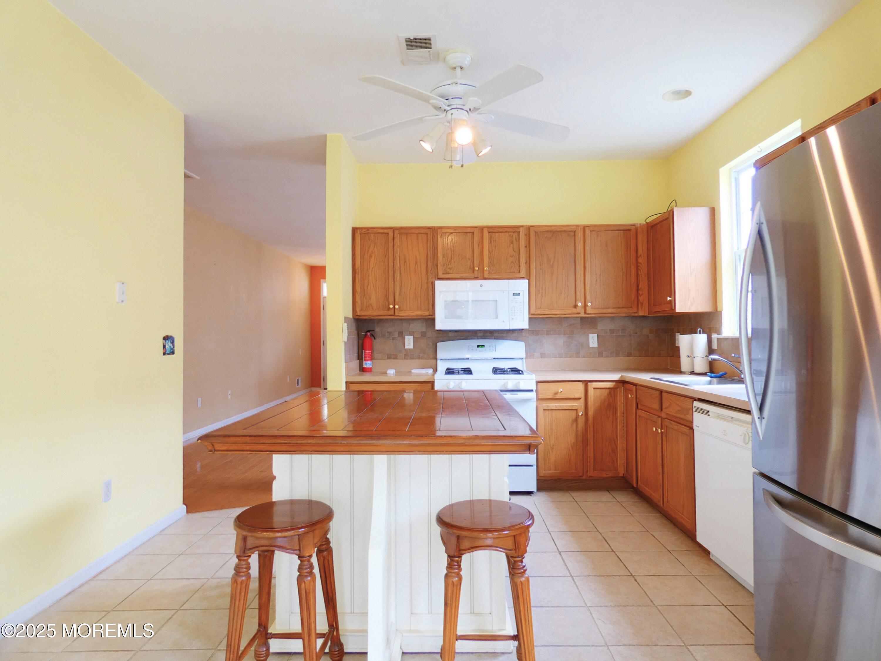 10 Lilly Drive Little Egg Harbor, NJ 08087 - Photo 8 of 28 a kitchen with appliances cabinets and a sink