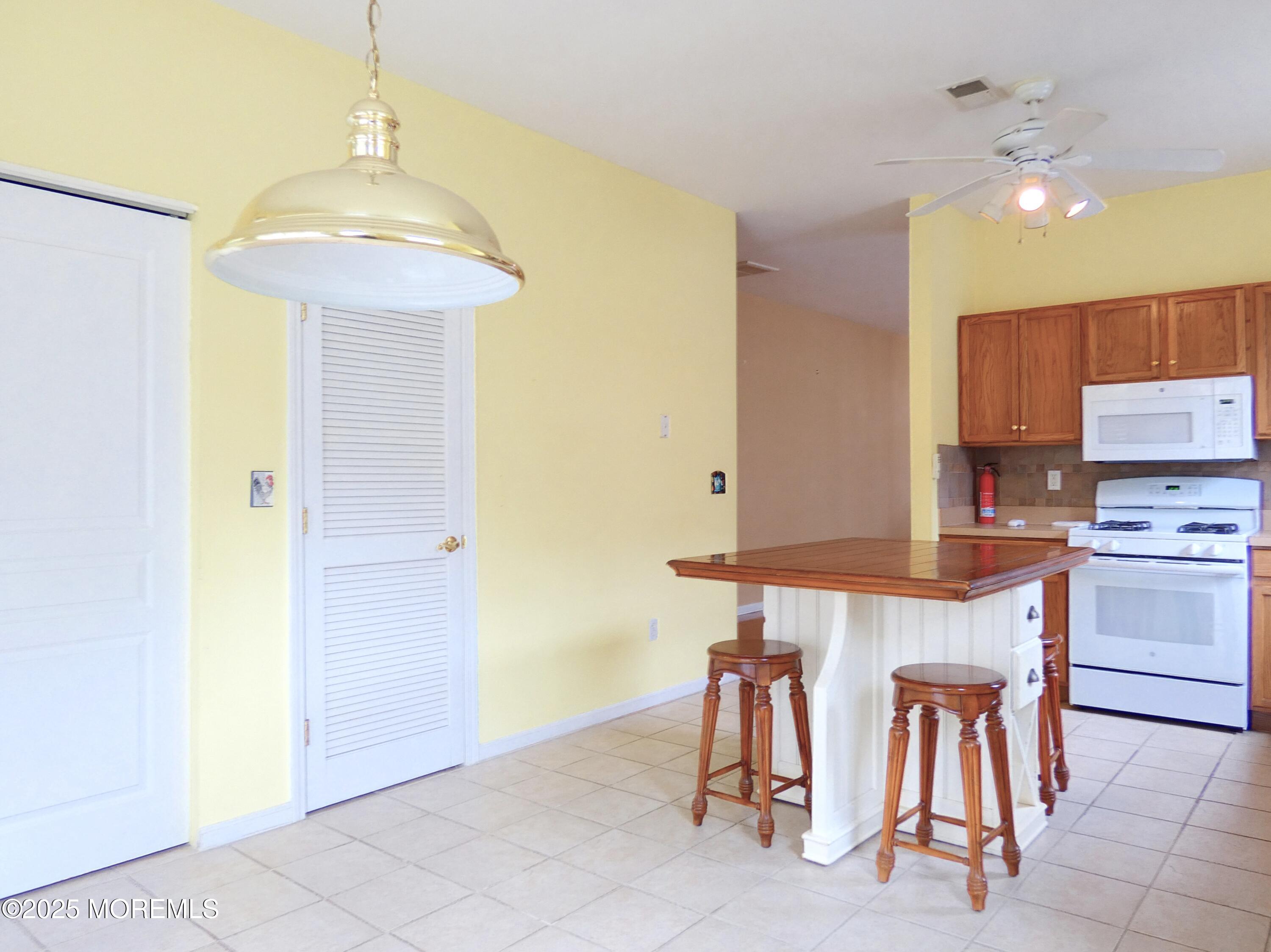 10 Lilly Drive Little Egg Harbor, NJ 08087 - Photo 9 of 28 a kitchen that has a table and chairs in it
