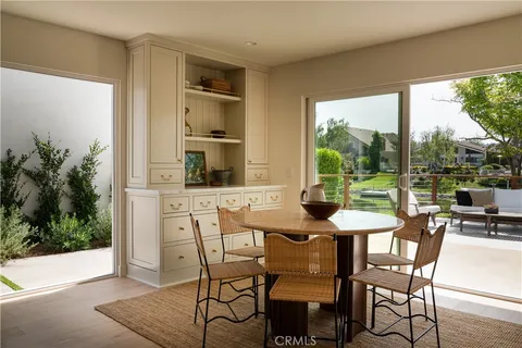 a kitchen with a table and chairs in it
