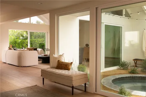 a bedroom with a bed and ceiling fan
