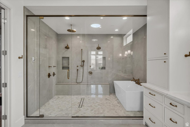2608 Canyon Ridge Drive St. George, UT 84770 - Photo 36 of 86 Primary bathroom: walk-in shower with full glass enclosure, dual shower heads, and built-in bench
