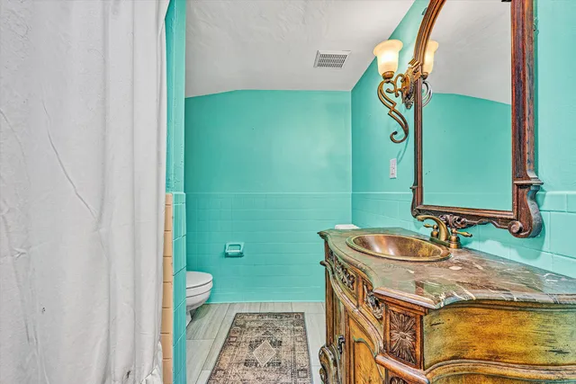 a bathroom with a sink a mirror and a bathtub