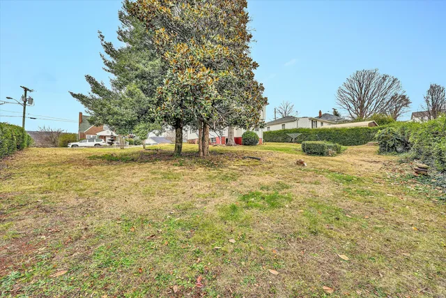 a view of a house with backyard porch and sitting area