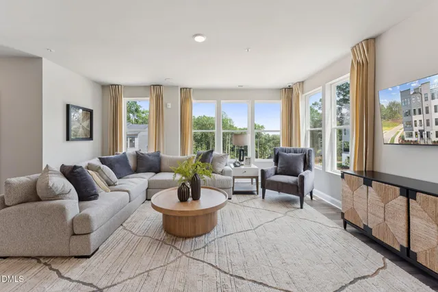 a kitchen with stainless steel appliances a table chairs and chandelier