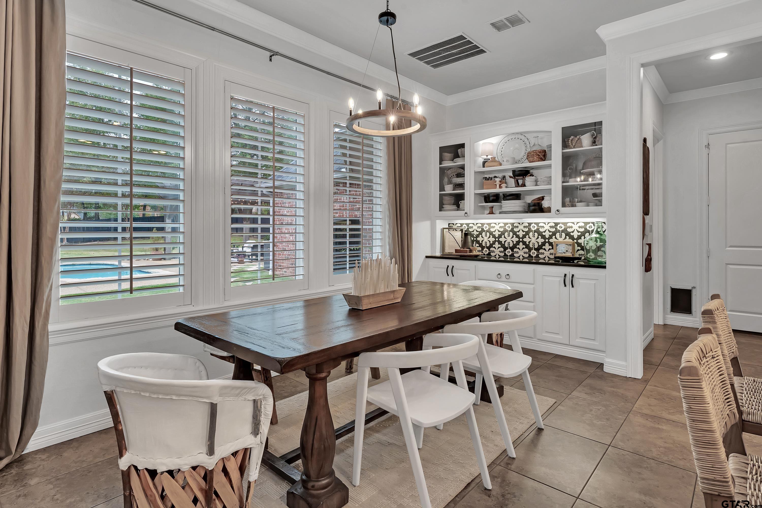 3901 Chase Crest Circle Longview, TX 75605 - Photo 12 of 44 a dining room with furniture and window