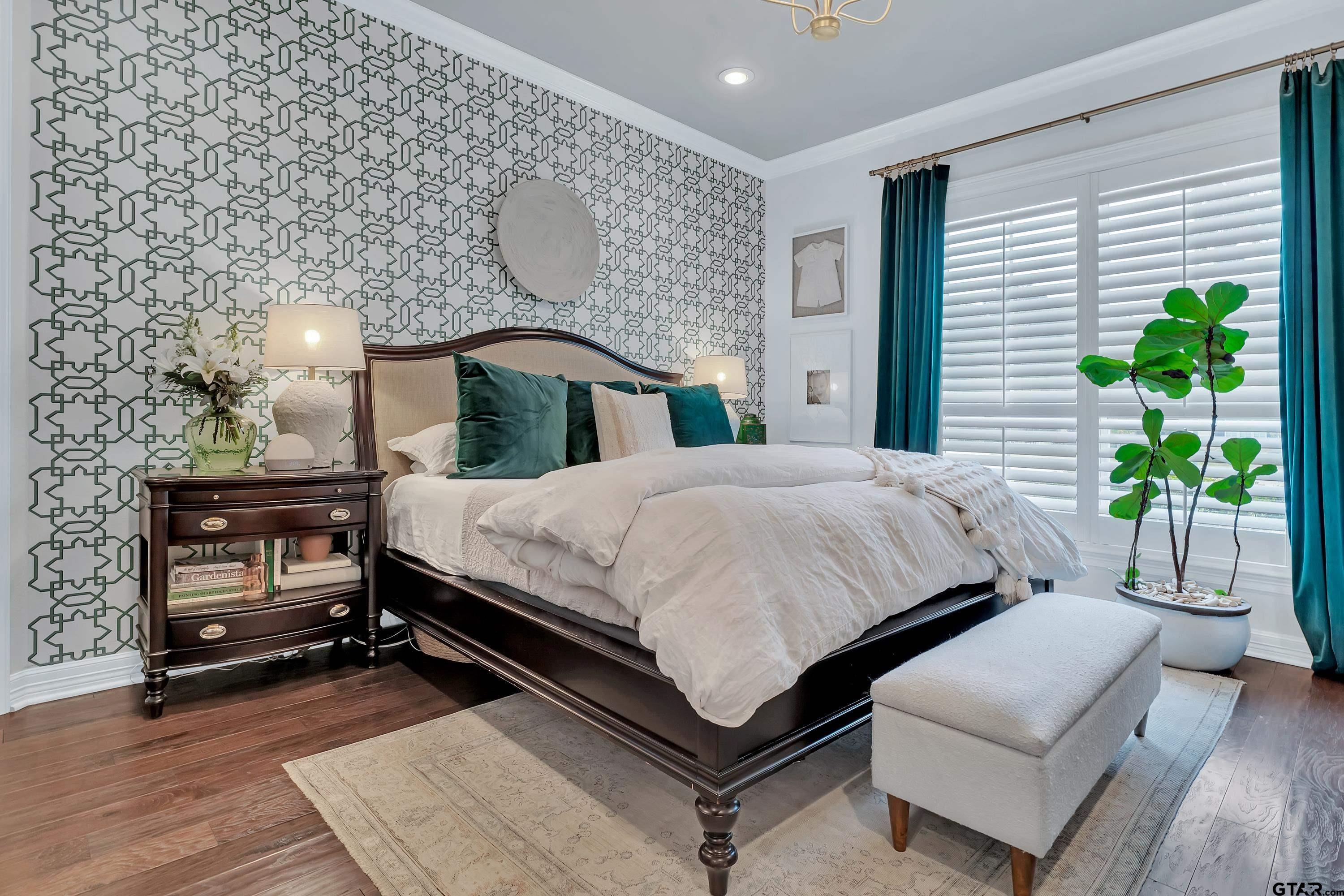 3901 Chase Crest Circle Longview, TX 75605 - Photo 18 of 44 a bedroom with a bed a lamp and potted plant