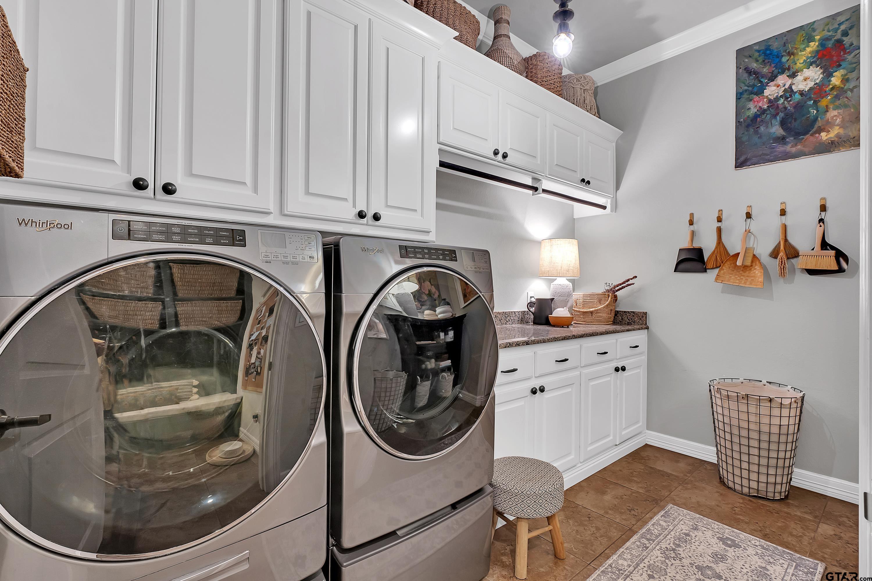3901 Chase Crest Circle Longview, TX 75605 - Photo 25 of 44 a utility room with sink dryer and washer