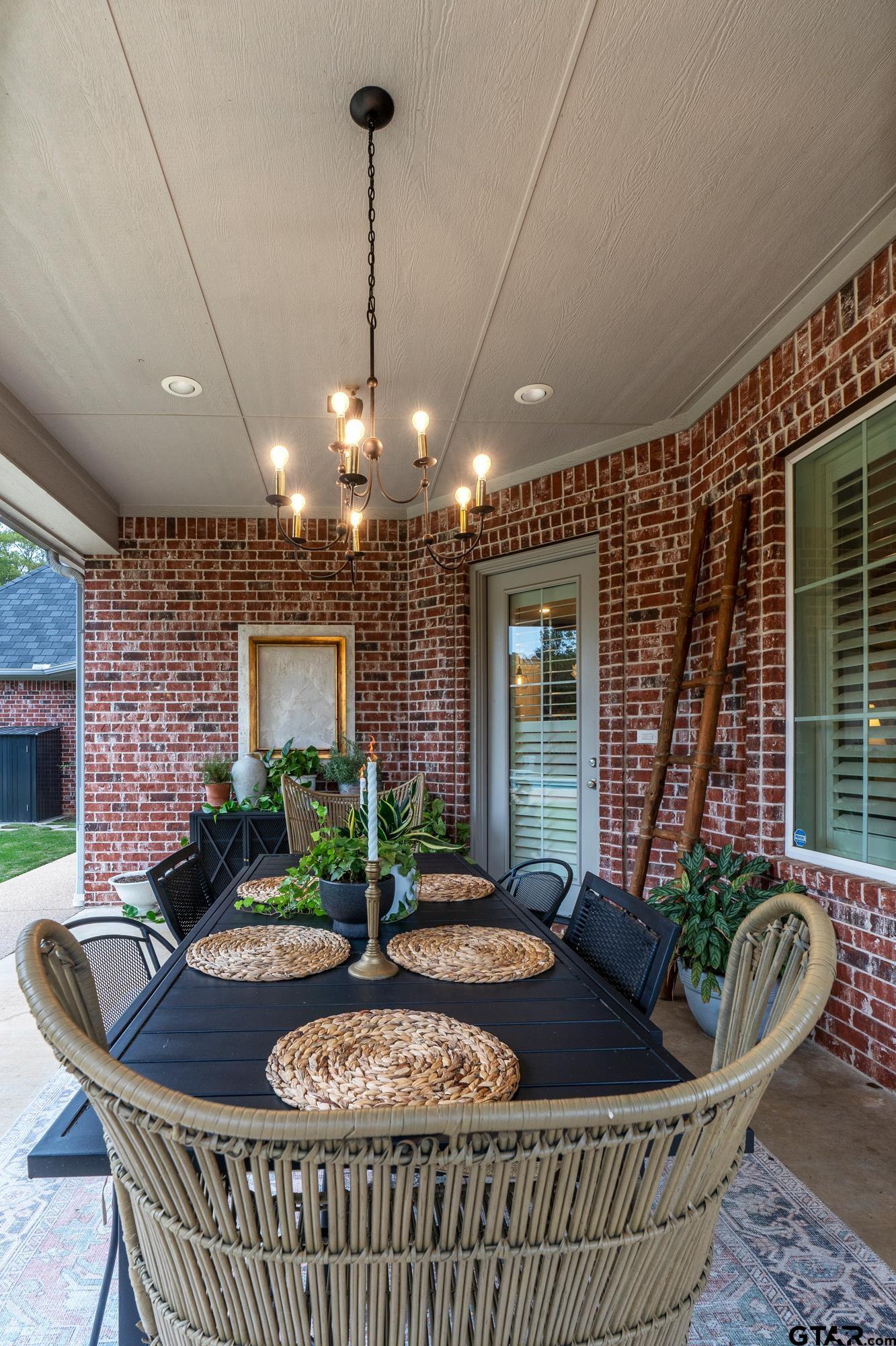 3901 Chase Crest Circle Longview, TX 75605 - Photo 36 of 44 a living room with furniture a window and a table