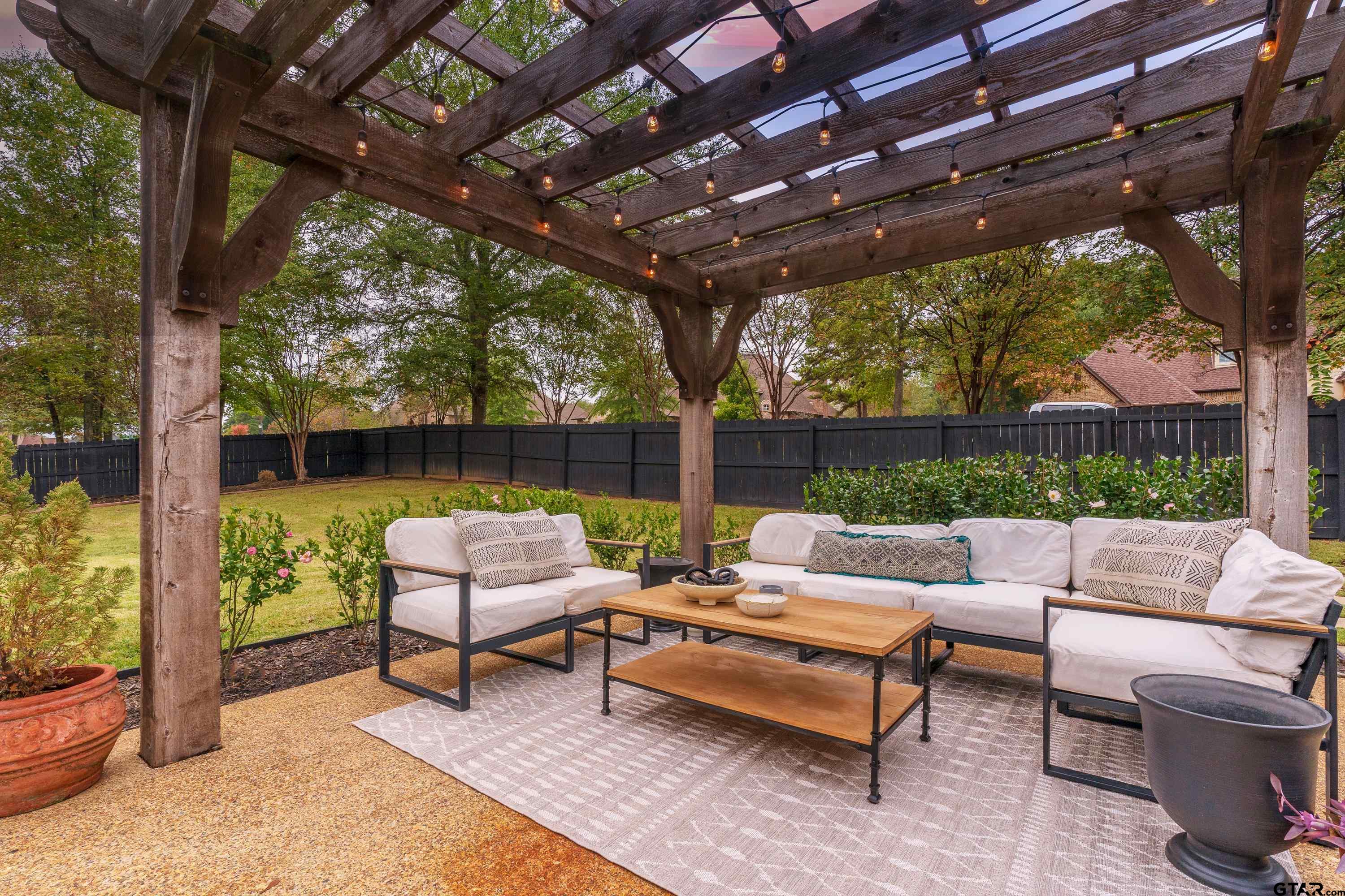 3901 Chase Crest Circle Longview, TX 75605 - Photo 38 of 44 a outdoor living space with patio furniture and a potted plant