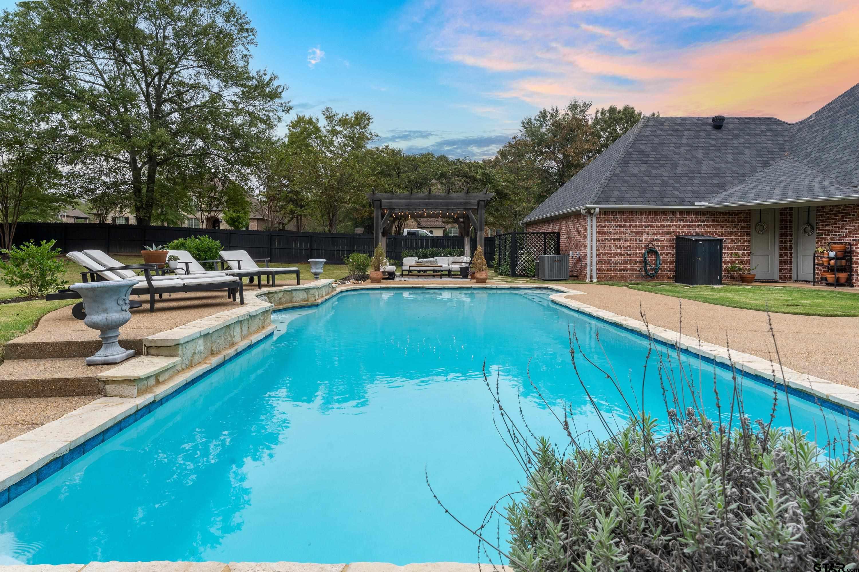 3901 Chase Crest Circle Longview, TX 75605 - Photo 41 of 44 a view of a house with pool and chairs