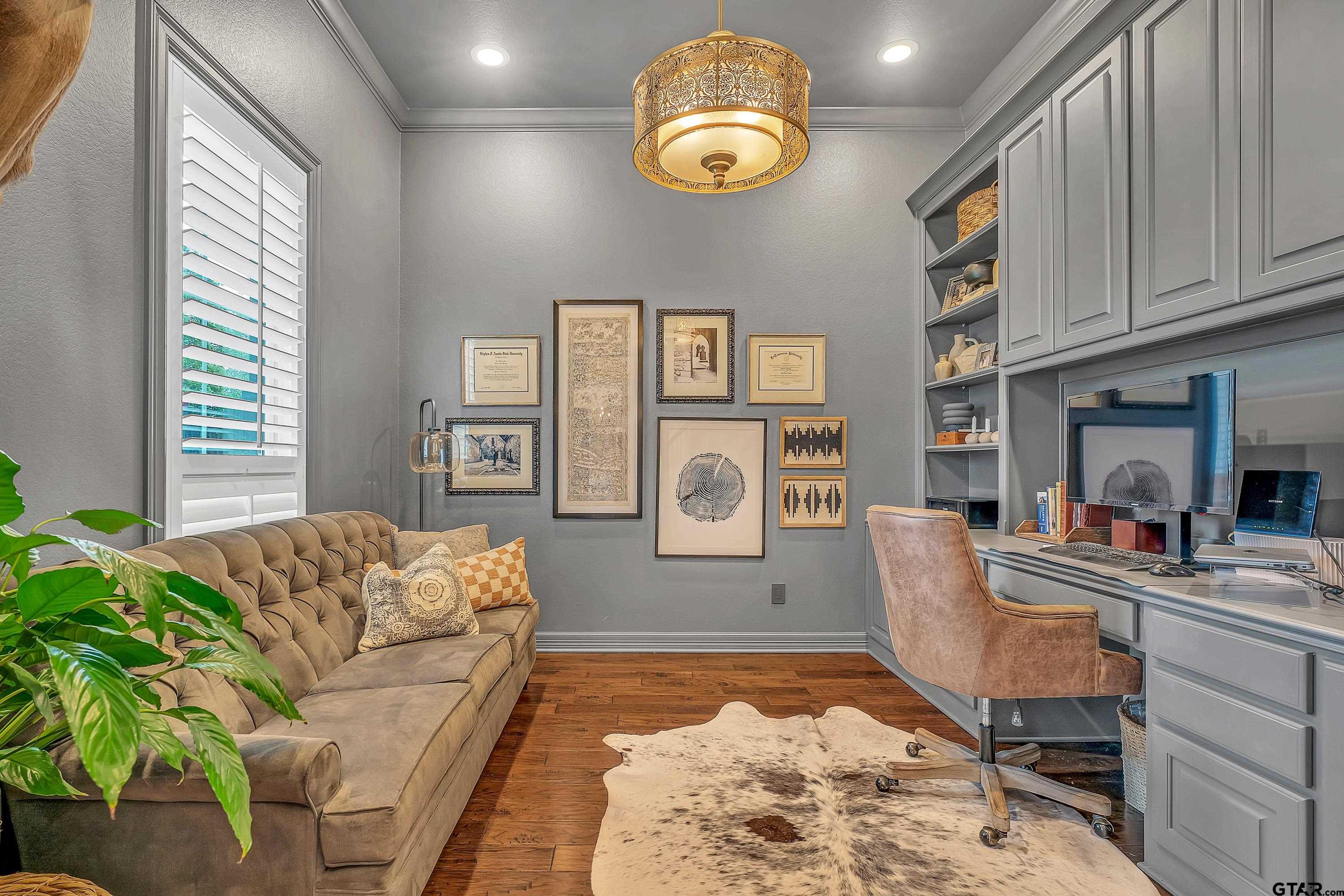 3901 Chase Crest Circle Longview, TX 75605 - Photo 6 of 44 a living room with furniture and painting on the wall
