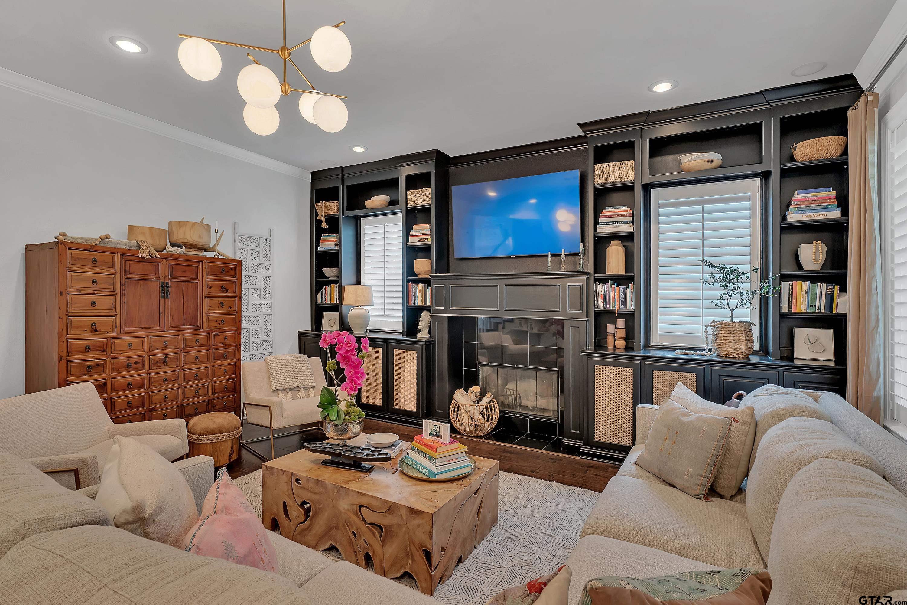 3901 Chase Crest Circle Longview, TX 75605 - Photo 9 of 44 a living room with furniture and a fireplace