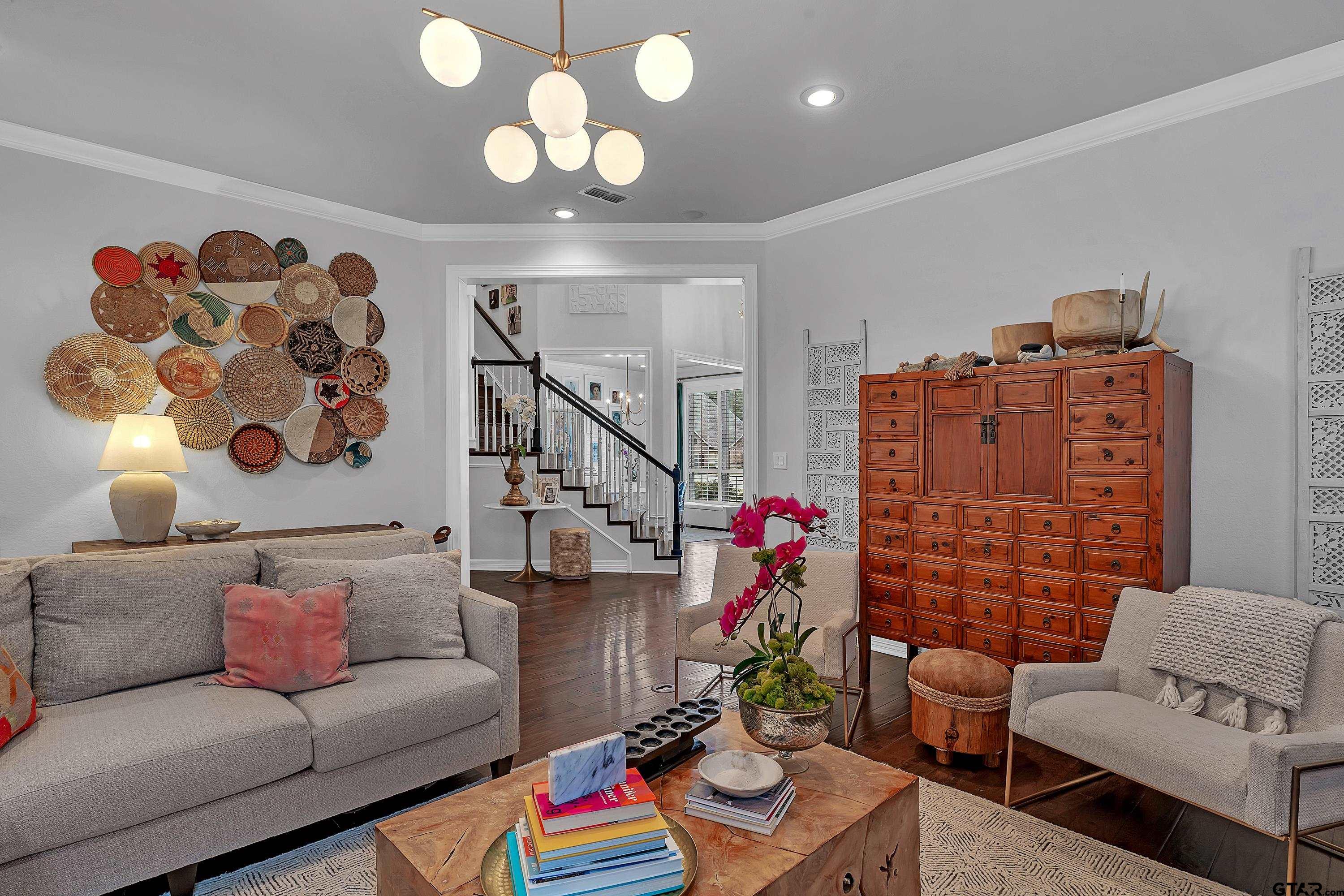 3901 Chase Crest Circle Longview, TX 75605 - Photo 10 of 44 a living room with furniture and a potted plant