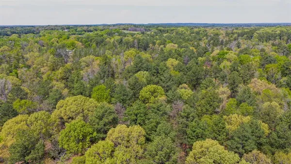 a view of a field with an ocean view