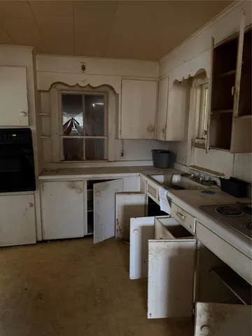 a view of an empty room with stairs