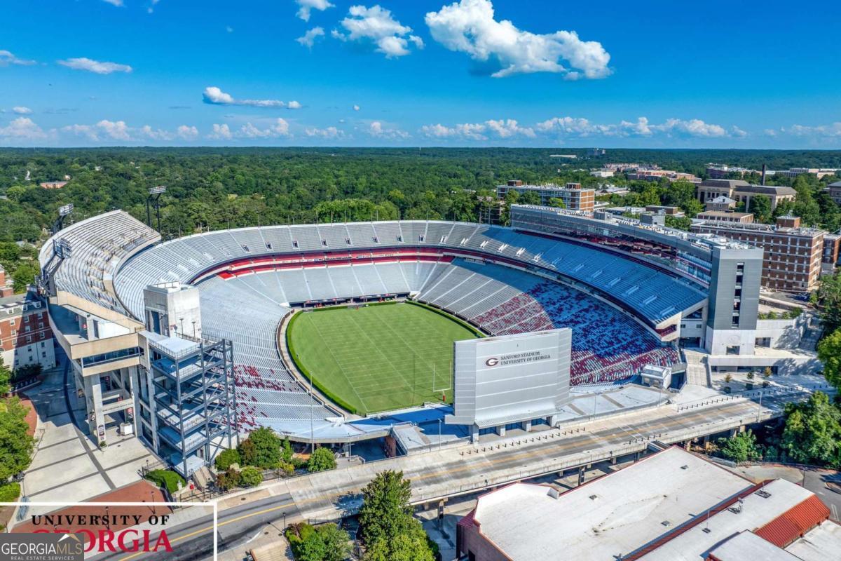 Lot 5 Stewart Loop Jefferson, GA 30549 - Photo 13 of 13 a view of a balcony with floor to ceiling windows with wooden floor