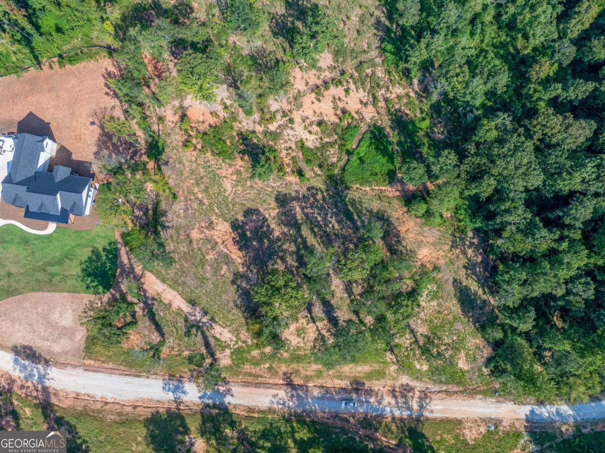 Lot 5 Stewart Loop Jefferson, GA 30549 - Photo 5 of 13 an aerial view of residential house with outdoor space and trees all around