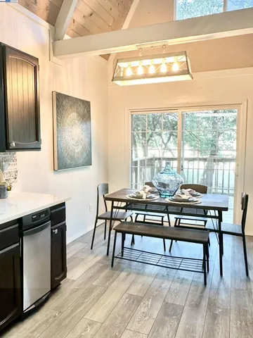 a view of a livingroom with furniture window and wooden floor