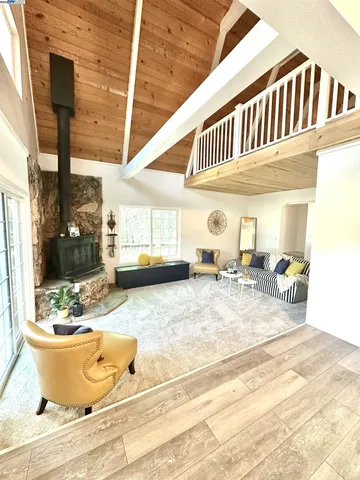 a view of a living room and bedroom