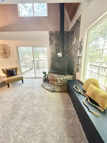 a balcony with wooden floor and fence