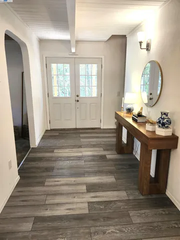 a bed sitting in a room next to a window