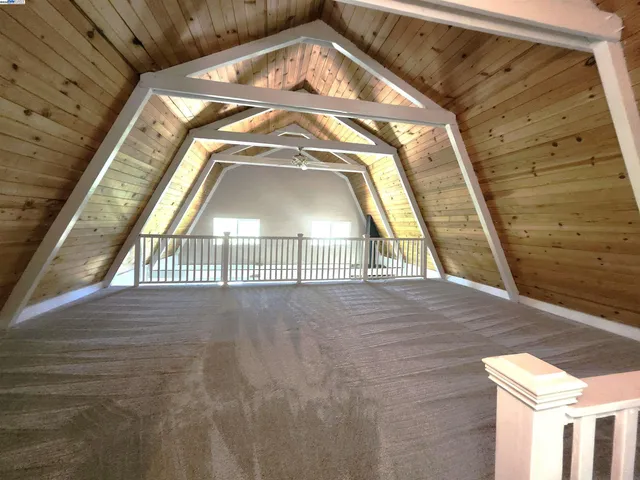 a view of a room with a wooden floor