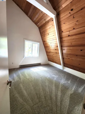 a view of backyard with green space and seating area