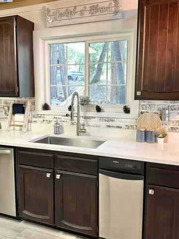 a bathroom with a sink and a window