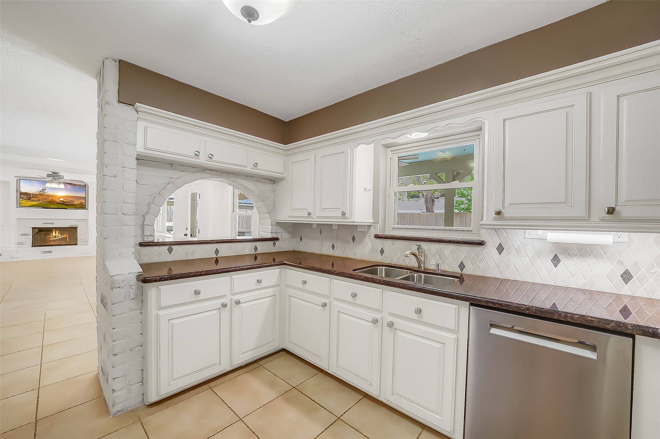 9519 Oxted Lane Spring, TX 77379 - Photo 11 of 40 a kitchen with white cabinets sink and window