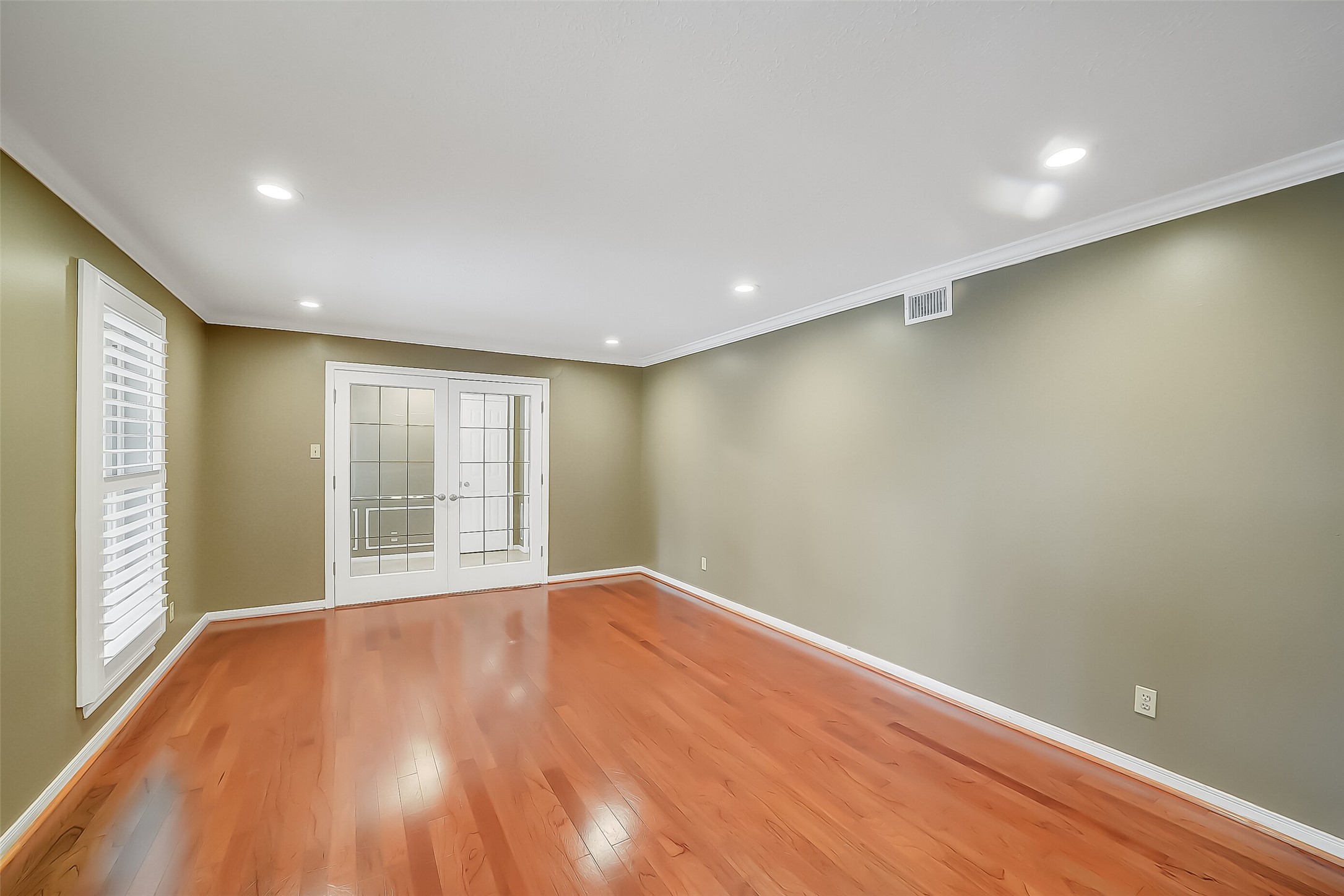 9519 Oxted Lane Spring, TX 77379 - Photo 12 of 40 a view of empty room with wooden floor and fan