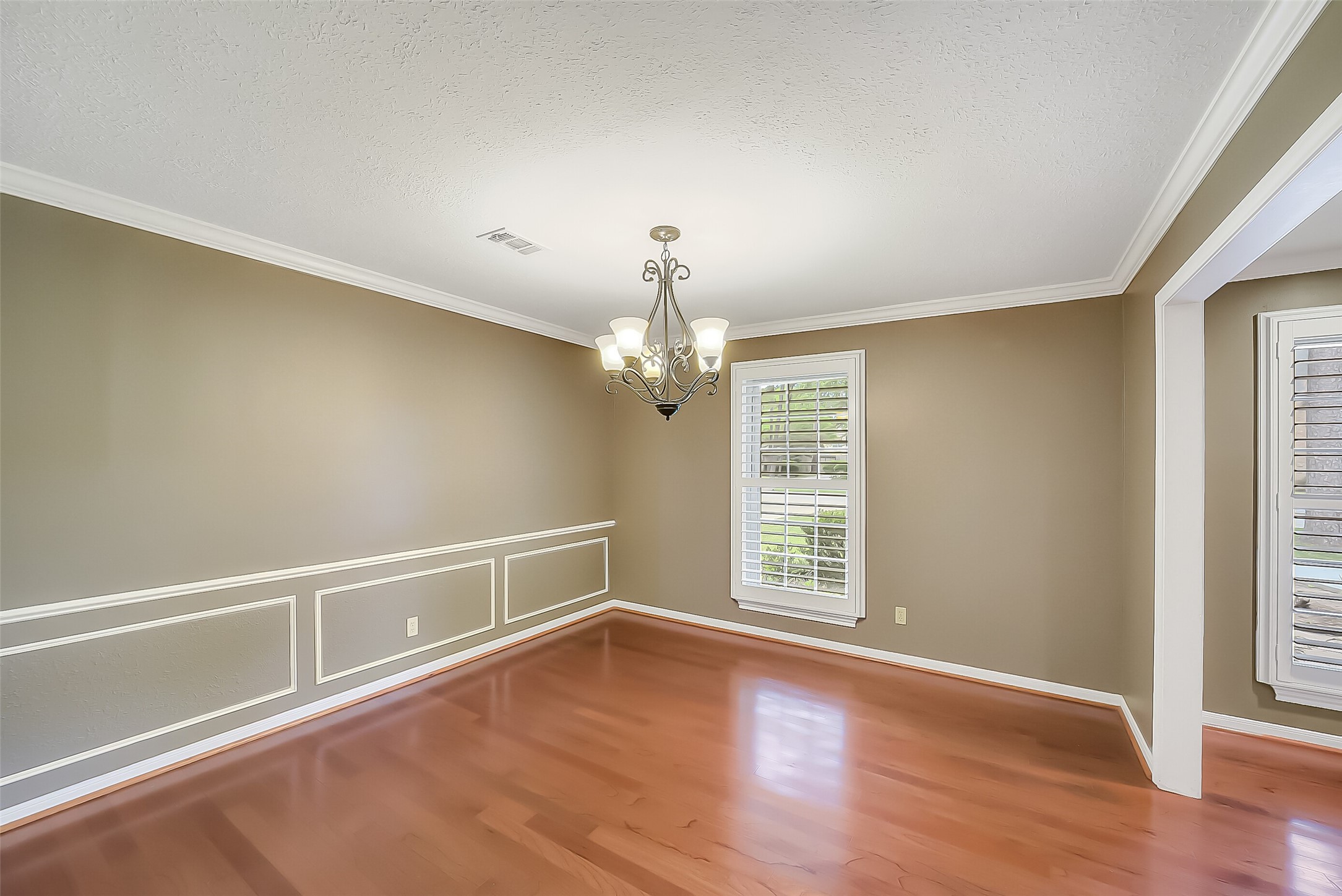 9519 Oxted Lane Spring, TX 77379 - Photo 14 of 40 wooden floor in an empty room with a window