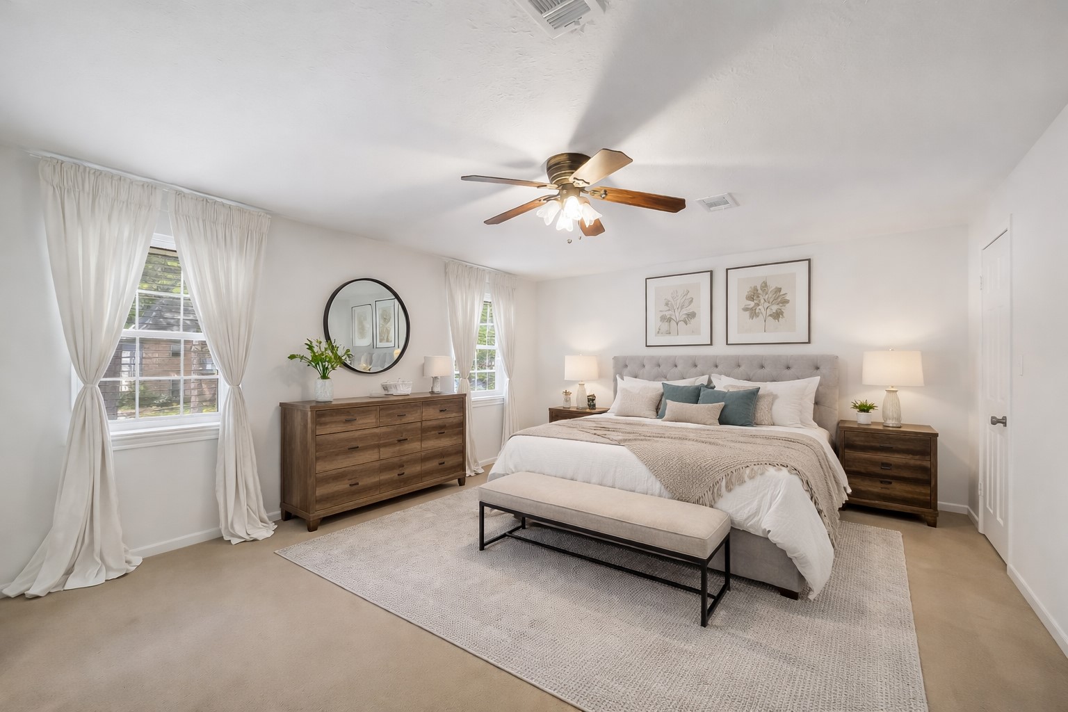 9519 Oxted Lane Spring, TX 77379 - Photo 17 of 40 a bedroom with a bed a chandelier and dresser