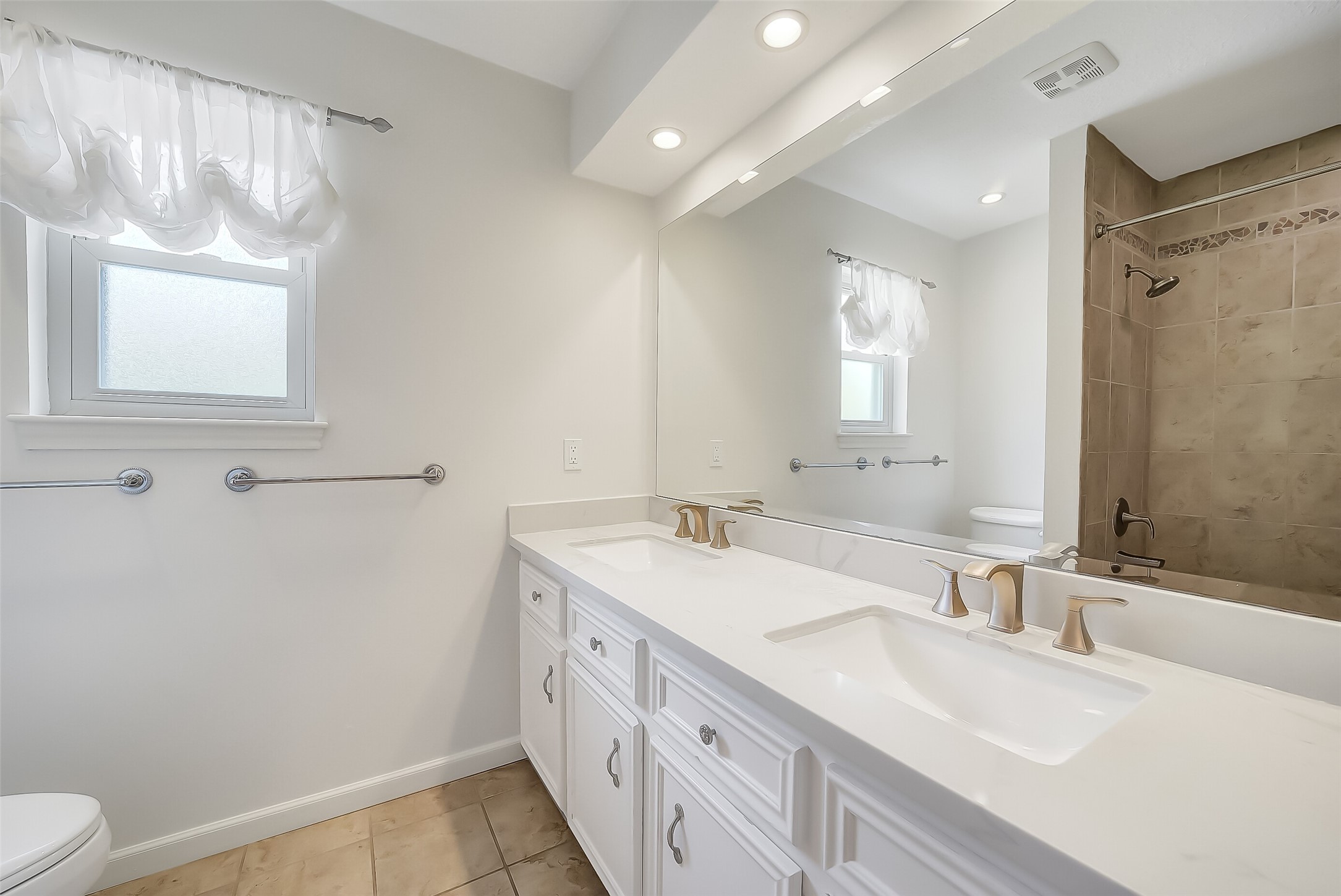 9519 Oxted Lane Spring, TX 77379 - Photo 24 of 40 a bathroom with a sink a toilet and a mirror