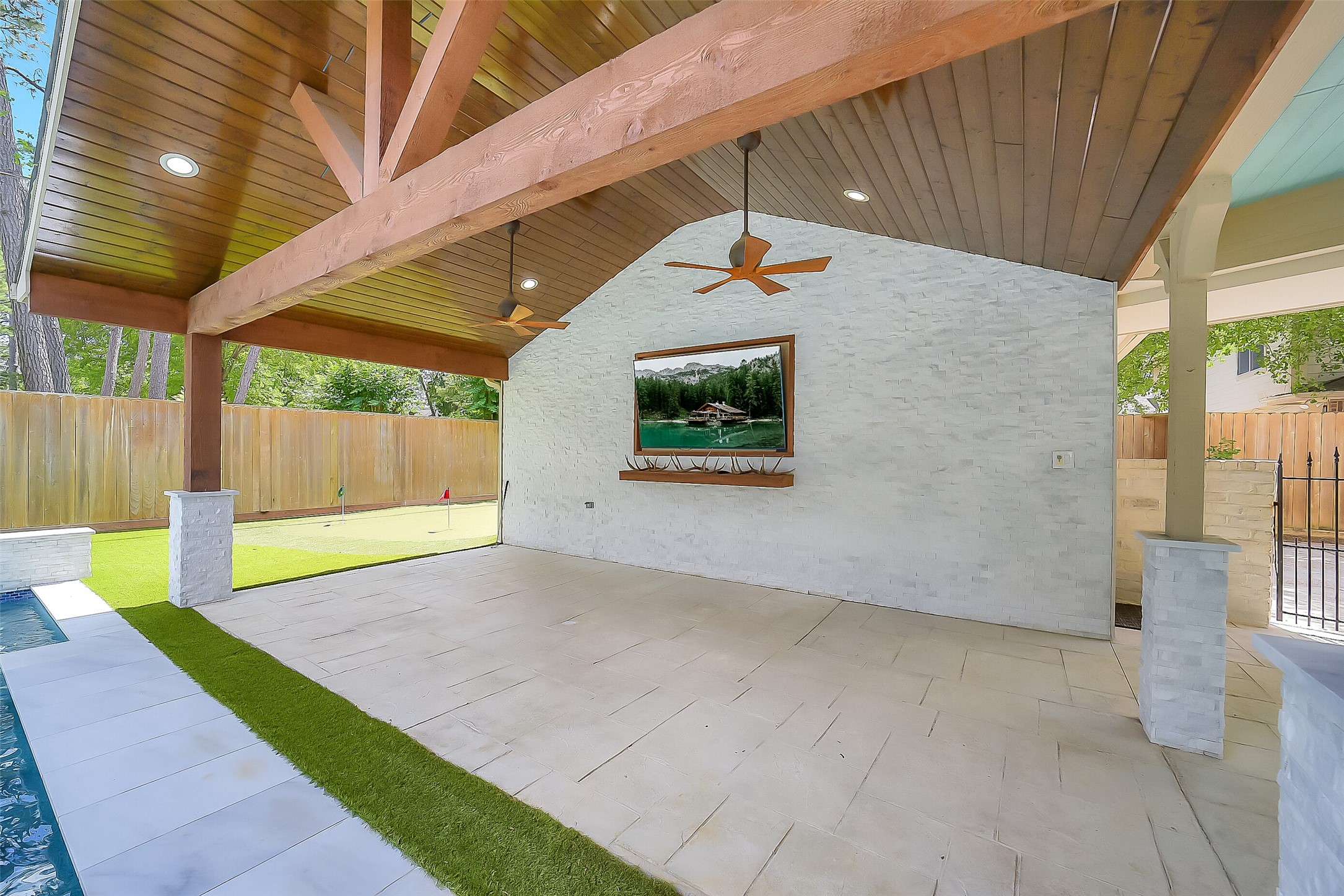 9519 Oxted Lane Spring, TX 77379 - Photo 27 of 40 a view of a backyard with a small cabin