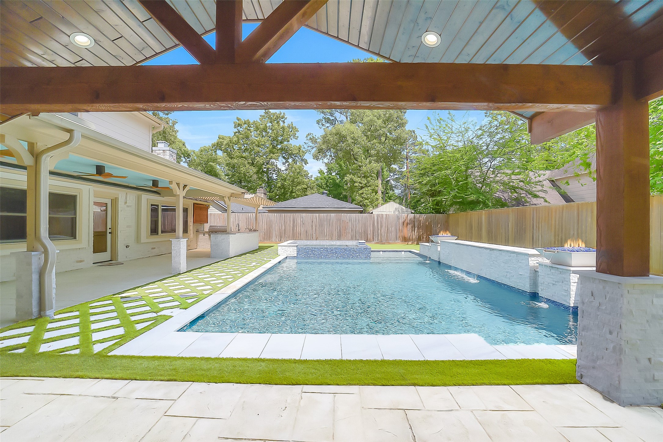 9519 Oxted Lane Spring, TX 77379 - Photo 30 of 40 a view of a backyard with a swimming pool