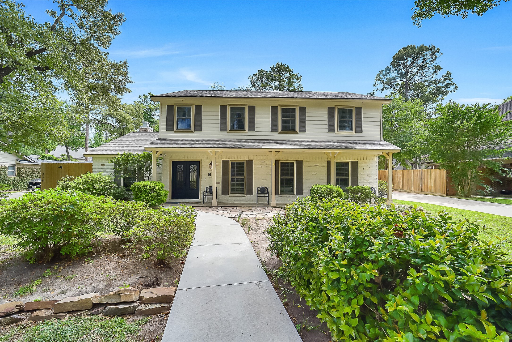 9519 Oxted Lane Spring, TX 77379 - Photo 3 of 40 a front view of a house with a yard