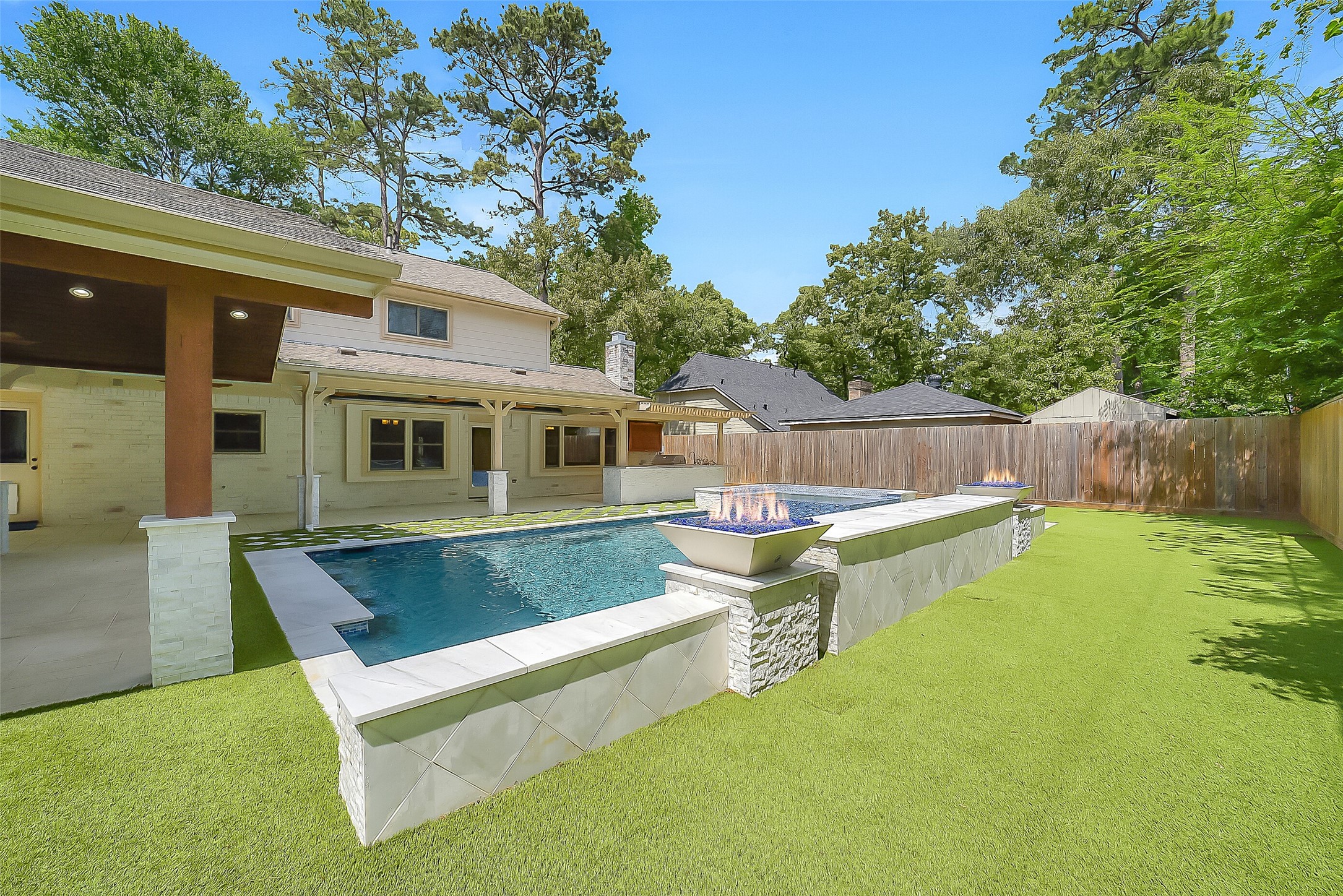 9519 Oxted Lane Spring, TX 77379 - Photo 32 of 40 a view of a white house with a backyard