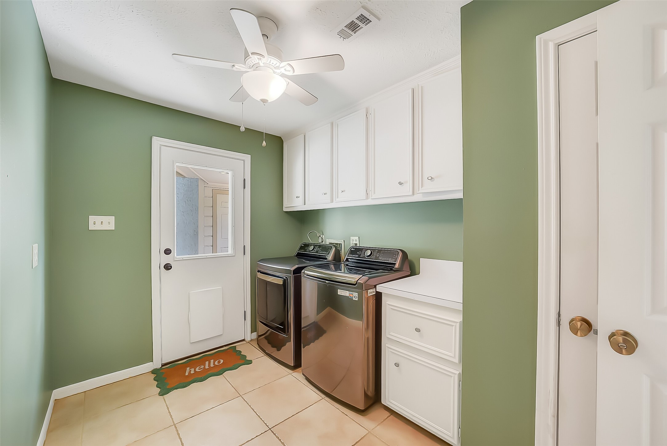 9519 Oxted Lane Spring, TX 77379 - Photo 37 of 40 a view of a kitchen with a stove cabinets and a window