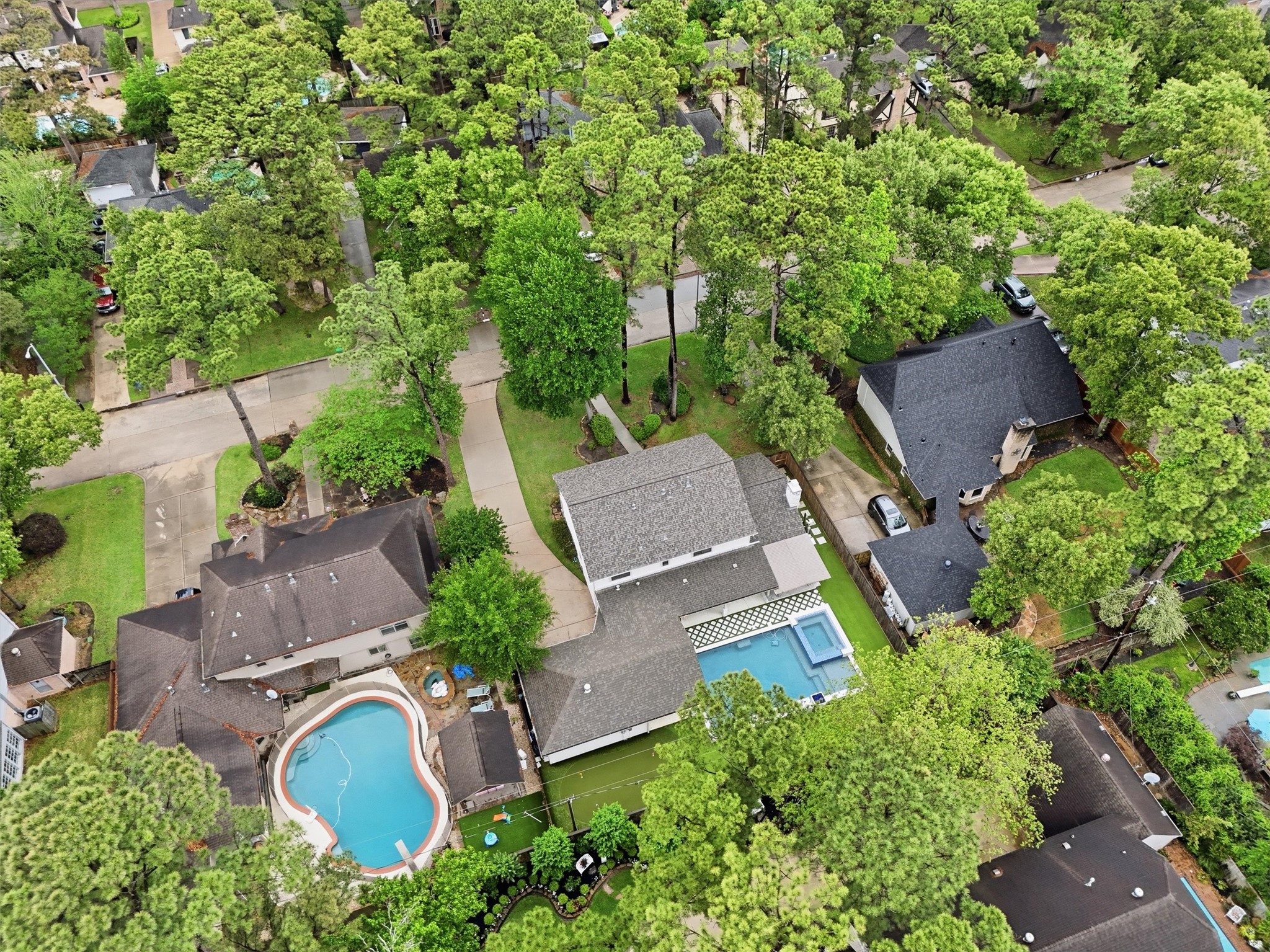 9519 Oxted Lane Spring, TX 77379 - Photo 40 of 40 an aerial view of a house with outdoor space and a swimming pool