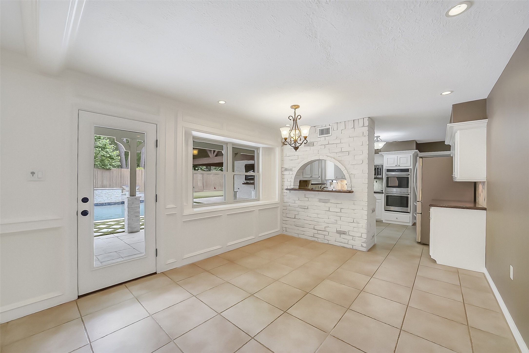 9519 Oxted Lane Spring, TX 77379 - Photo 7 of 40 a kitchen with stainless steel appliances cabinets and a window