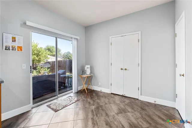 a view of room with window and furniture